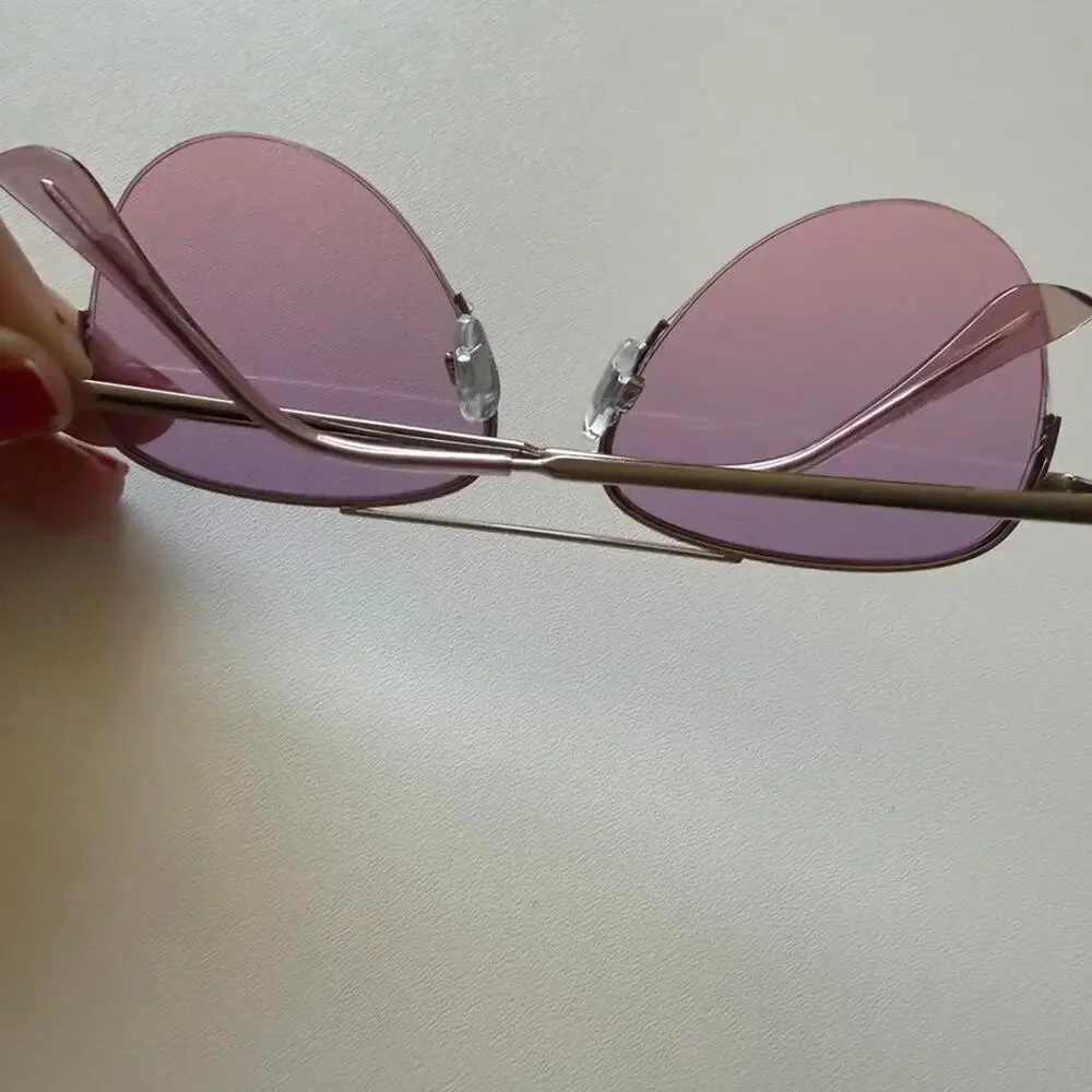 Gold aviator sunglasses with purple